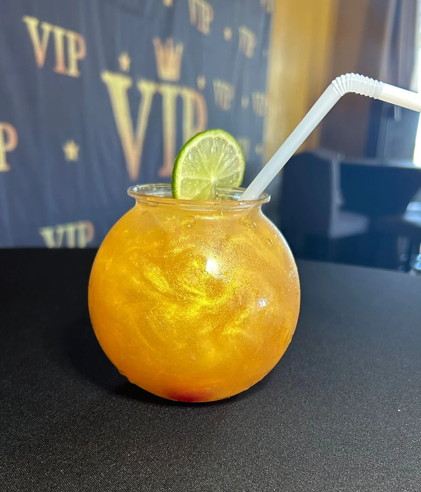 A colourful Club VIP cocktail with lime