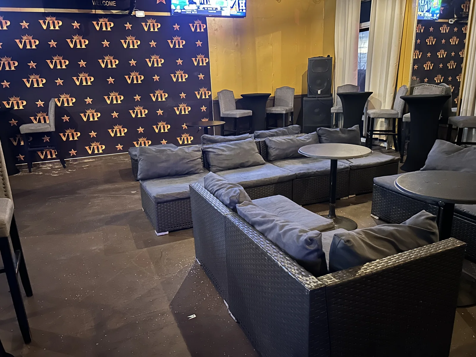 Club VIP seating area and branded celebration backdrop